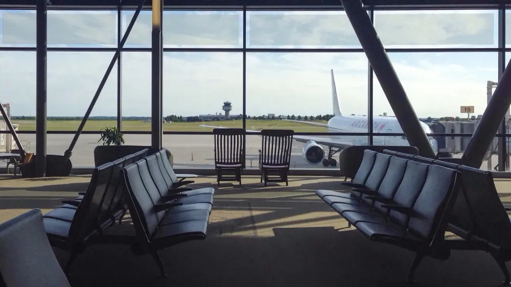empty airport waiting area airplane out window